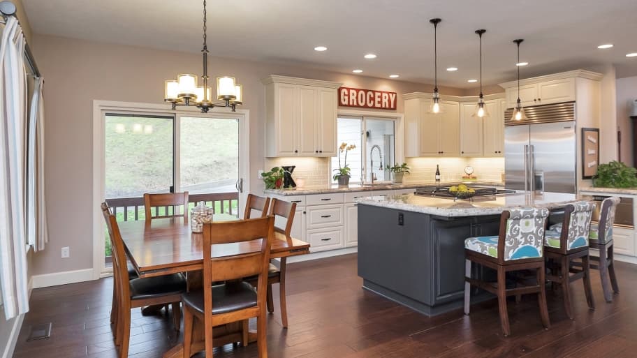 Open kitchen and dining area remodeled by HouseCraft